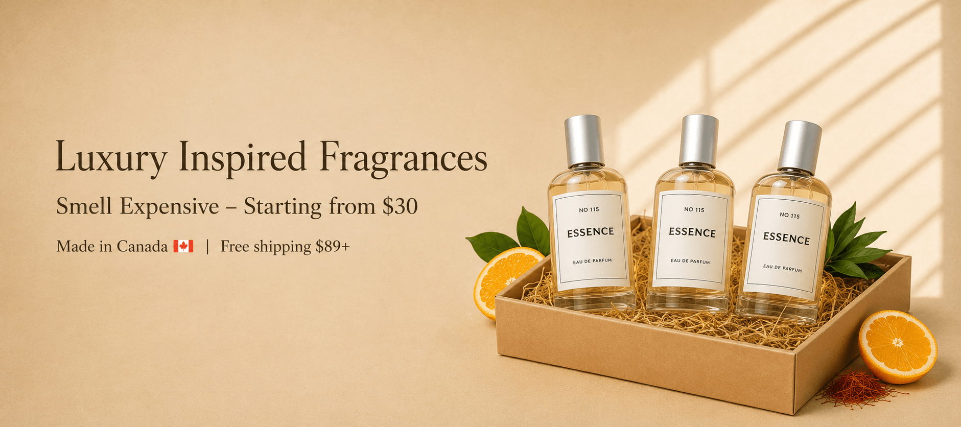 Three bottles of 'ESSENCE' fragrances in a cardboard tray with oranges on a beige background.